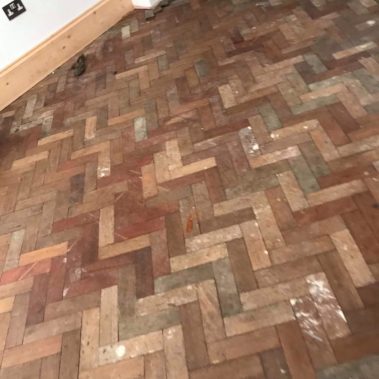 Reclaimed mahogany parquet installed - Weatherby
