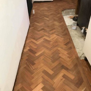 Reclaimed mahogany parquet installed - Weatherby