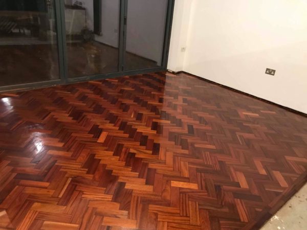 Reclaimed mahogany parquet installed - Weatherby